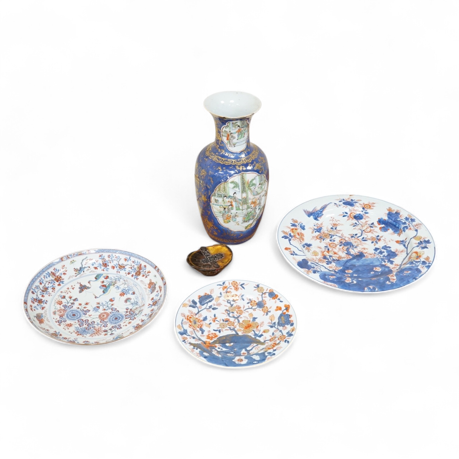 Three early 18th century Chinese Imari dishes (one clobbered), largest 46.5cm, together with a 19th century Chinese powder blue ground vase, 44cm high and a horn carving, 13.7cm (5)
